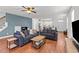 Inviting living room with hardwood floors, open layout, comfortable seating and easy access to the kitchen at 215 Seventh St, Wake Forest, NC 27587