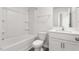 Well-lit bathroom showcases a vanity, a toilet and a shower-tub combo with grab bars at 279 Canopy Dr, Graham, NC 27253