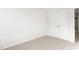 Bedroom with double doors and light carpet at 279 Canopy Dr, Graham, NC 27253