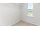 Walk-in closet with wire shelving and a window for natural light at 279 Canopy Dr, Graham, NC 27253