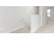 Neutral hallway with carpeted floors and white walls at 279 Canopy Dr, Graham, NC 27253