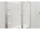 Shower with glass doors and built-in shelving at 279 Canopy Dr, Graham, NC 27253