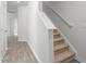 Bright interior staircase with carpeted steps and white walls at 279 Canopy Dr, Graham, NC 27253