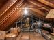 Spacious unfinished attic with exposed wooden beams, insulation, and storage possibilities at 3005 Woodgreen Dr, Raleigh, NC 27607