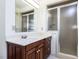 Bathroom with a wood vanity and a glass door shower with a frosted glass at 3005 Woodgreen Dr, Raleigh, NC 27607