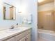 Bright bathroom with a tub/shower combination, vanity, and neutral decor at 3005 Woodgreen Dr, Raleigh, NC 27607