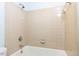 Bathroom featuring a tub and shower combo with tiled walls at 3005 Woodgreen Dr, Raleigh, NC 27607