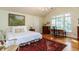 Bright bedroom featuring a decorative rug, Queen bed, and beautiful painting at 3005 Woodgreen Dr, Raleigh, NC 27607