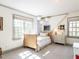Bedroom featuring a bed, windows, and carpeting at 3005 Woodgreen Dr, Raleigh, NC 27607