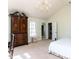 Bedroom featuring a chandelier, large windows, and views of the outside at 3005 Woodgreen Dr, Raleigh, NC 27607