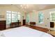Bright bedroom featuring multiple windows and a traditional-style interior at 3005 Woodgreen Dr, Raleigh, NC 27607