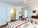 Cozy bedroom with two beds, a ceiling fan, and an attached bathroom with double doors at 3005 Woodgreen Dr, Raleigh, NC 27607
