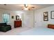 Bright bedroom with carpet, window with blinds, dresser, and a built in closet at 3005 Woodgreen Dr, Raleigh, NC 27607