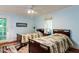 Bedroom featuring two beds, light blue walls, and a ceiling fan at 3005 Woodgreen Dr, Raleigh, NC 27607