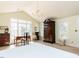 Bright bedroom with large windows, a chandelier, and classic furnishings at 3005 Woodgreen Dr, Raleigh, NC 27607