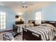 Comfortable bedroom features two twin beds, ceiling fan, and access to the exterior patio at 3005 Woodgreen Dr, Raleigh, NC 27607