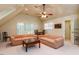 Bonus room with neutral decor, two sofas, large windows, and a ceiling fan at 3005 Woodgreen Dr, Raleigh, NC 27607