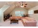 Bonus room with neutral decor, two sofas, and large windows at 3005 Woodgreen Dr, Raleigh, NC 27607