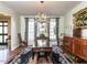 Formal dining room with a chandelier, elegant furnishings, and natural light at 3005 Woodgreen Dr, Raleigh, NC 27607