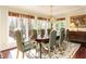 Bright dining room with large windows, comfortable seating, and stylish decor at 3005 Woodgreen Dr, Raleigh, NC 27607