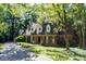 Charming home with lush green lawn, mature trees and long driveway at 3005 Woodgreen Dr, Raleigh, NC 27607