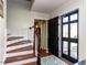 Welcoming foyer with staircase, hardwood floors, and stylish front door at 3005 Woodgreen Dr, Raleigh, NC 27607