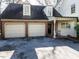 Spacious two-car garage with brick facade and driveway at 3005 Woodgreen Dr, Raleigh, NC 27607