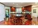 Beautiful kitchen with cherry cabinets, granite countertops, and a central island with seating at 3005 Woodgreen Dr, Raleigh, NC 27607