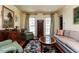 Comfortable living room with hardwood floors, area rug and large sofa at 3005 Woodgreen Dr, Raleigh, NC 27607