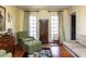 Cozy living room with large windows, comfortable seating, and natural light at 3005 Woodgreen Dr, Raleigh, NC 27607