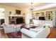 Inviting living room with a brick fireplace and built-in shelving at 3005 Woodgreen Dr, Raleigh, NC 27607