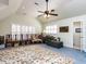 A spacious living room with sitting chairs, hardwood floors, and natural light at 3005 Woodgreen Dr, Raleigh, NC 27607