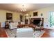 Cozy living room with fireplace, area rug, and a classic aesthetic at 3005 Woodgreen Dr, Raleigh, NC 27607