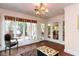 Bright living room with large windows, chair, and decorative coffee table at 3005 Woodgreen Dr, Raleigh, NC 27607