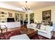 Cozy living room featuring built-in shelves, plush seating, and a decorative rug at 3005 Woodgreen Dr, Raleigh, NC 27607