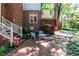 The brick patio has a table with chairs, accessible from the backyard area and the house at 3005 Woodgreen Dr, Raleigh, NC 27607