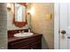 Stylish powder room featuring vanity with sink and decorative mirror at 3005 Woodgreen Dr, Raleigh, NC 27607