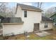 The rear of the house shows the siding, patio, and yard at 3323 Nantuckett Ave, Durham, NC 27703