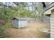 The backyard has a shed and sparse vegetation at 3323 Nantuckett Ave, Durham, NC 27703