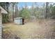 The backyard has a shed and some sparse vegetation at 3323 Nantuckett Ave, Durham, NC 27703