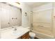 Bathroom with a vanity, mirror, toilet, and a shower-tub combo, showing signs of wear at 3323 Nantuckett Ave, Durham, NC 27703