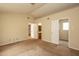 Bedroom with two doors, a ceiling light, and access to the bathroom; showing visible wear and tear at 3323 Nantuckett Ave, Durham, NC 27703
