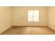 Bedroom with neutral carpeting, a window providing natural light, and blank walls at 3323 Nantuckett Ave, Durham, NC 27703