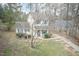 Inviting two-story home with blue shutters, neat landscaping, and a paved driveway at 3323 Nantuckett Ave, Durham, NC 27703