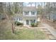 Charming two-story home featuring blue shutters, a well-maintained lawn, and a private driveway at 3323 Nantuckett Ave, Durham, NC 27703