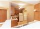 Functional kitchen featuring light wood cabinets, a sink, and access to laundry room at 3323 Nantuckett Ave, Durham, NC 27703