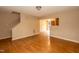 Cozy living room with hardwood floors and staircase leading upstairs for a charming home at 3323 Nantuckett Ave, Durham, NC 27703