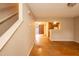 Spacious living room featuring hardwood floors, sliding glass doors, stairs, and an open-concept layout at 3323 Nantuckett Ave, Durham, NC 27703