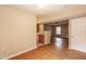 Open-concept living area with hardwood floors seamlessly connecting to the dining area and kitchen at 3323 Nantuckett Ave, Durham, NC 27703