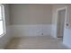 Bright and airy bedroom with wainscoting and large windows, a blank canvas ready for personal decoration at 358 Coats Ridge Dr, Benson, NC 27504